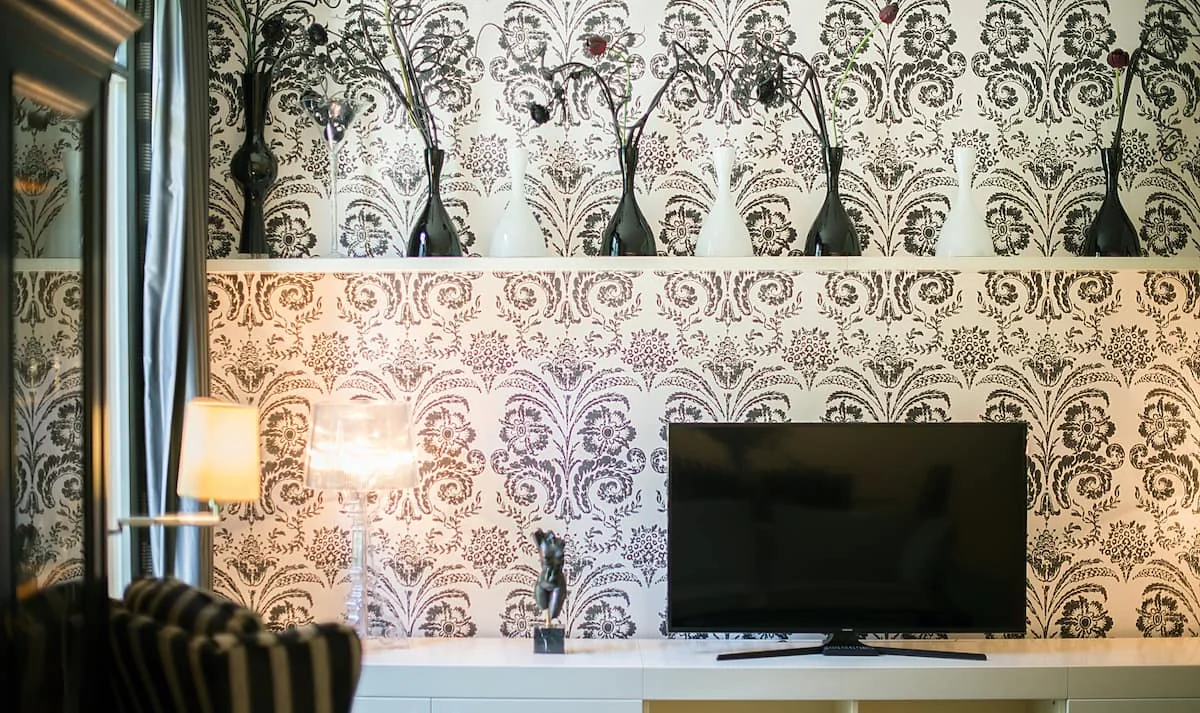Casa Verdú living-room television and patterned feature wall