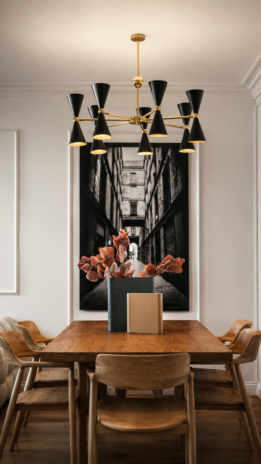 PDG15 apartment dining room with walnut table, sculptural black chandelier, and Barcelona artwork
