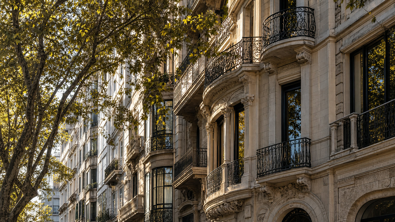 Historic Passeig de Gracia facade with balconies and warm Barcelona light