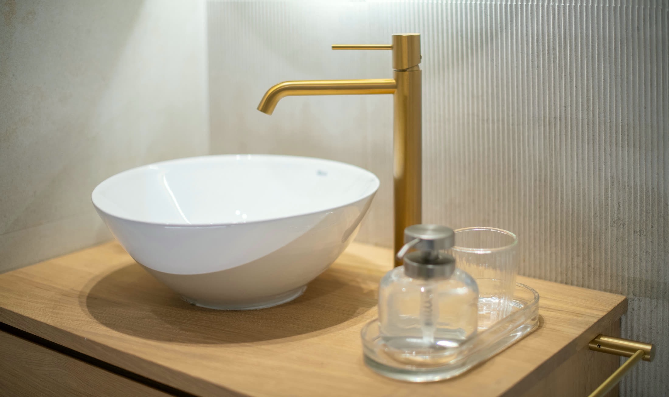 Brass tap and vessel sink detail in Suite Alba