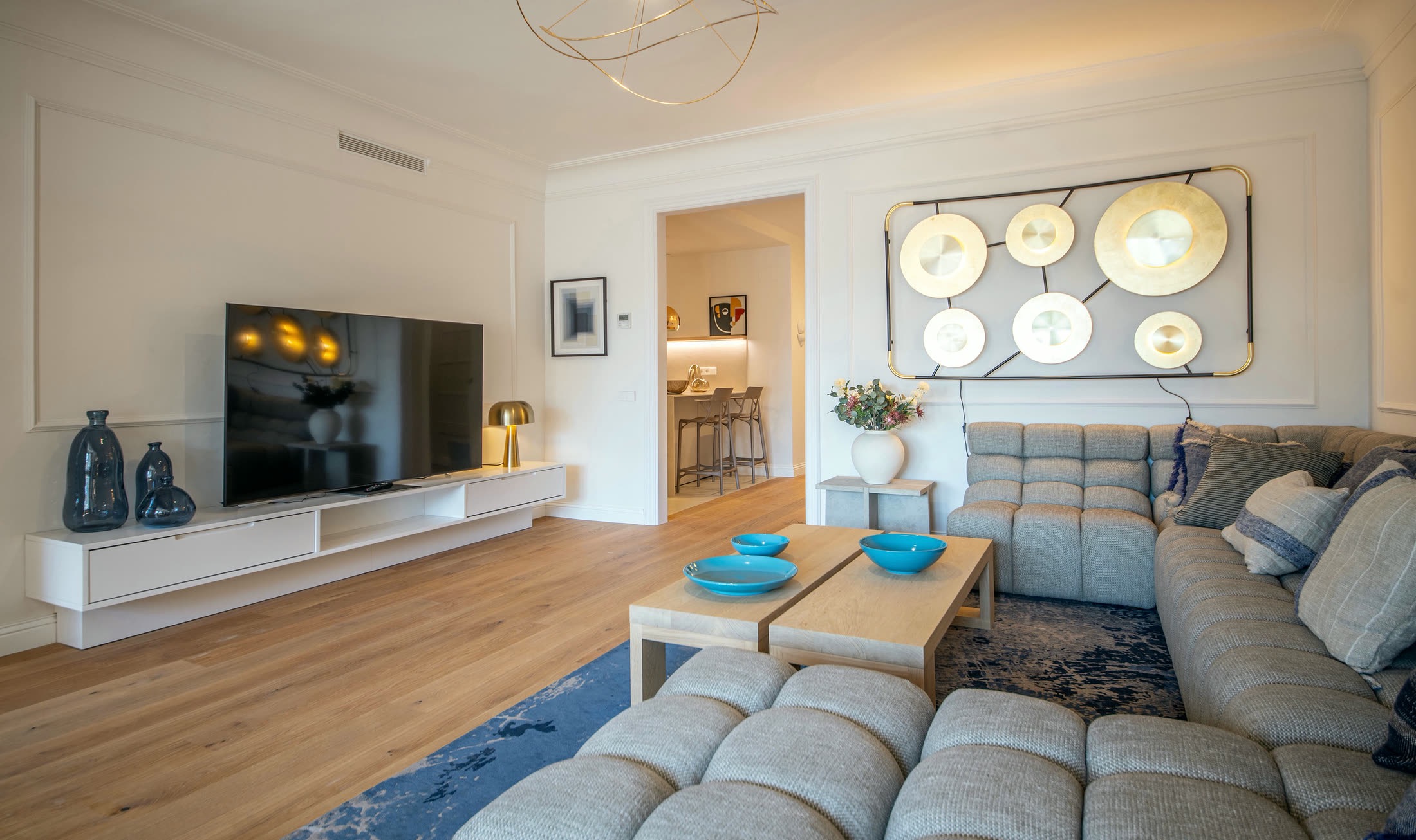Suite Alba living room with a 75-inch television