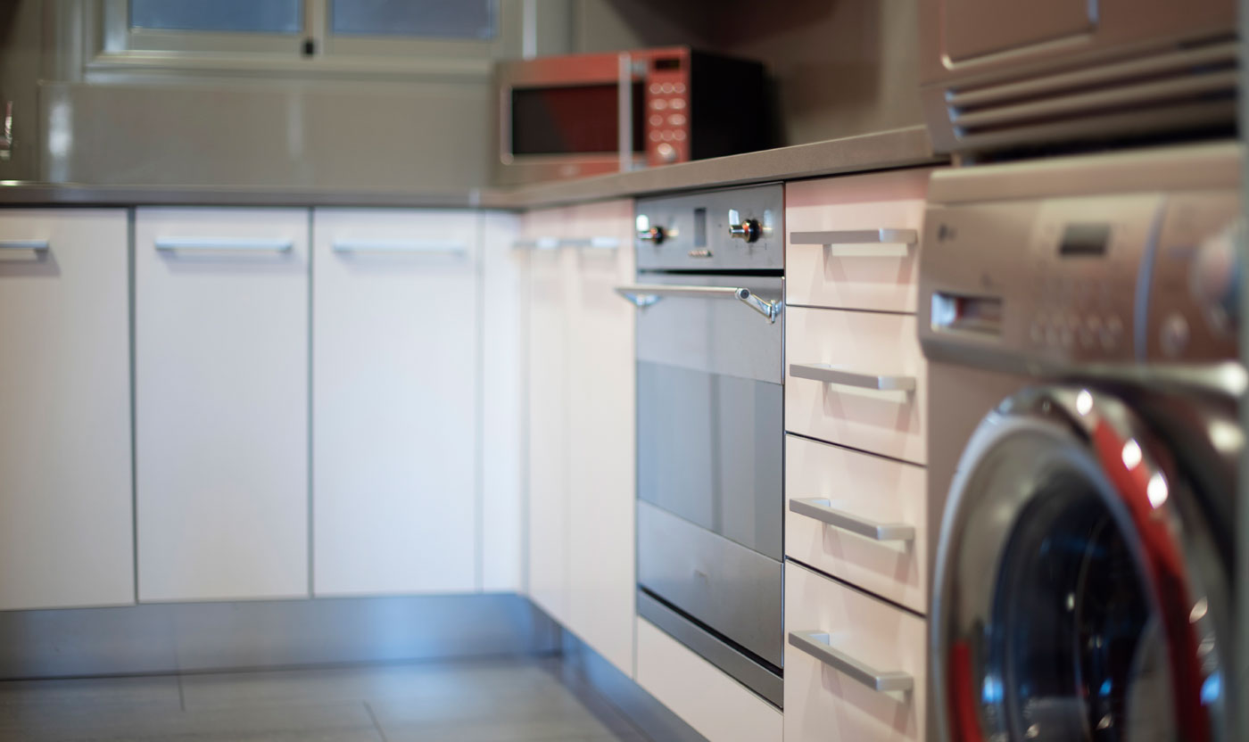 Oven, dishwasher and washing machine in the Suite Sagrada kitchen