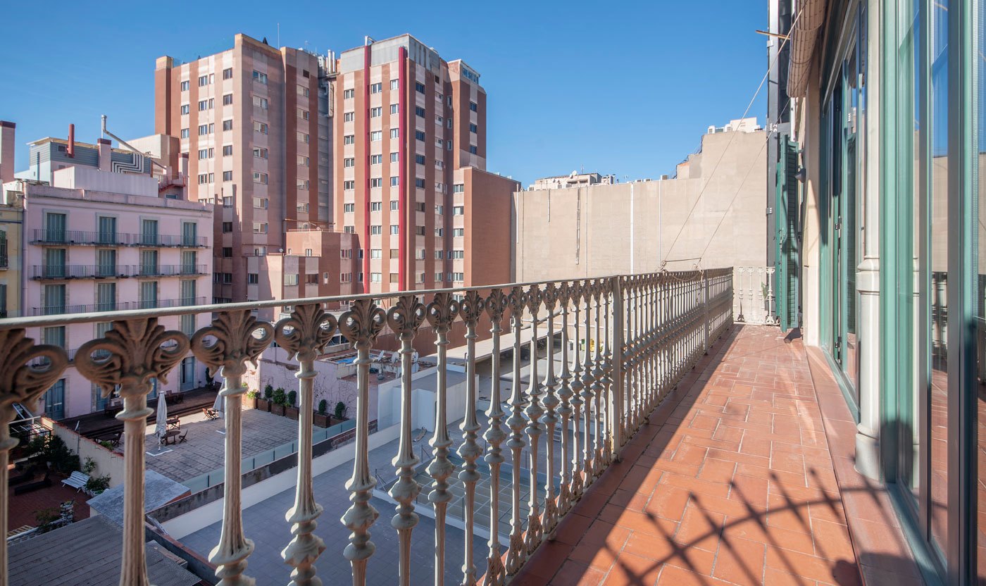 Suite Sol&eacute;a balcony overlooking the rooftops around Passeig de Gr&agrave;cia